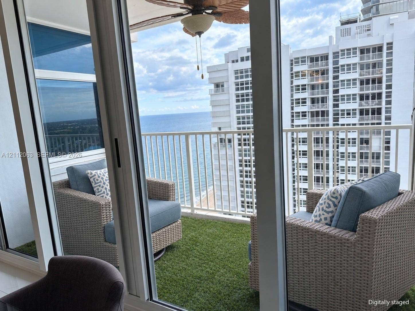1360 S Ocean Boulevard, #2503, Pompano Beach, Pompano Beach, FL 33062 Private balcony featuring artificial turf flooring, white metal railing, and ocean horizon backdrop