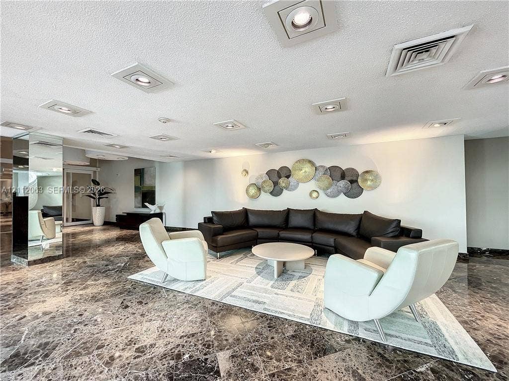 1360 S Ocean Boulevard, #2503, Pompano Beach, Pompano Beach, FL 33062 Spacious interior featuring polished stone flooring, recessed ceiling lighting, and mirrored structural columns