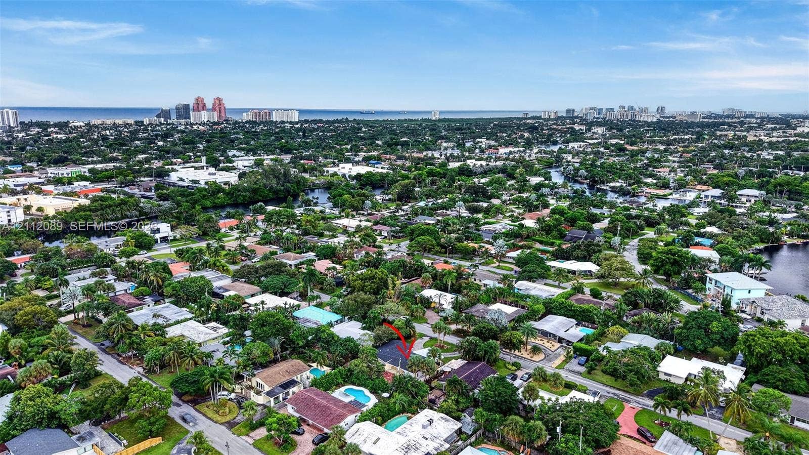 2017 NE 29th Court, Fort Lauderdale, FL 33306 Aerial perspective of residential neighborhood featuring mature tree canopy, proximity to regional waterways, and coastal horizon
