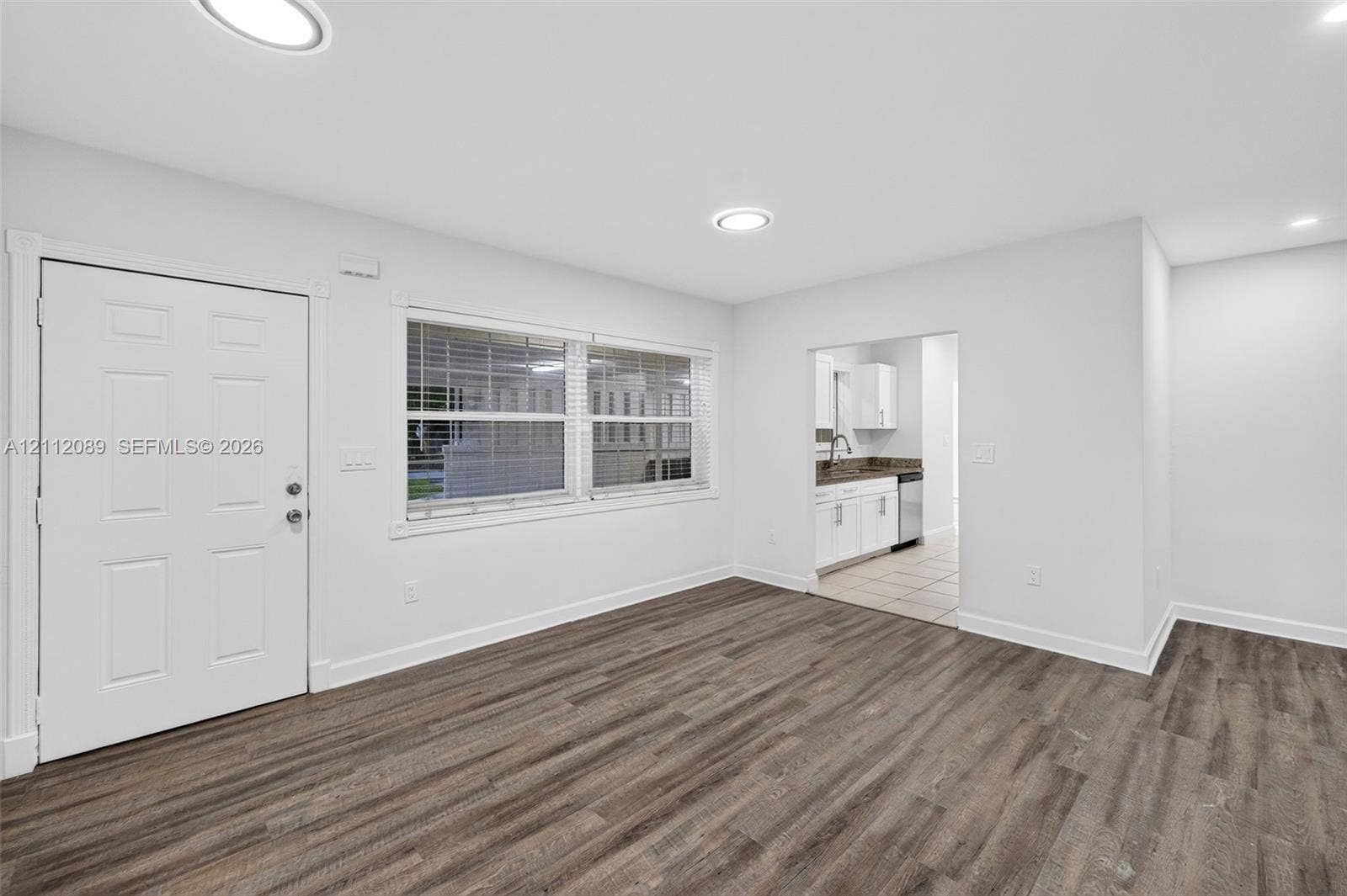 2017 NE 29th Court, Fort Lauderdale, FL 33306 Interior space featuring wood-finish flooring, recessed lighting, and a six-panel entry door
