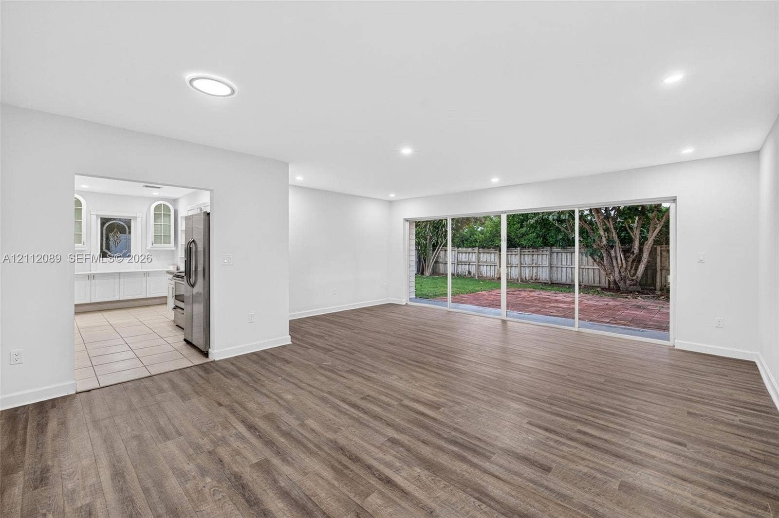 2017 NE 29th Court, Fort Lauderdale, FL 33306 Interior space featuring wood-finish flooring, recessed lighting, and large sliding glass doors