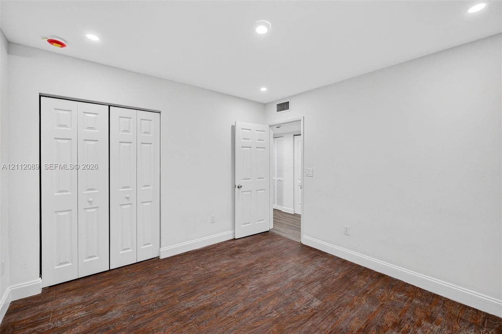 2017 NE 29th Court, Fort Lauderdale, FL 33306 Interior room featuring wood-finish flooring, recessed lighting, and a bi-fold closet