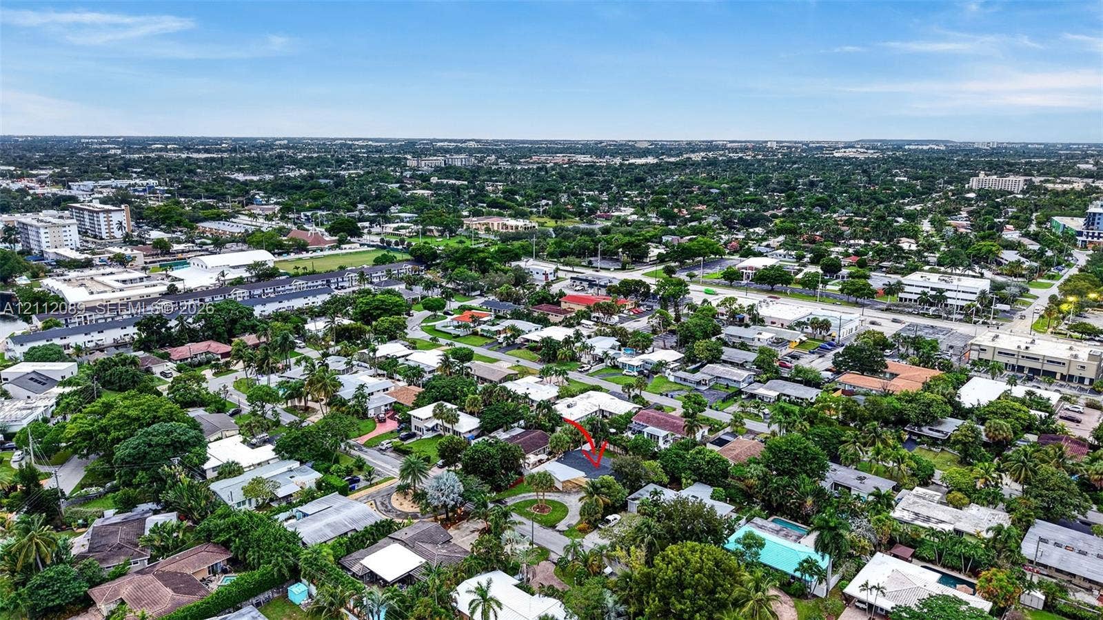 2017 NE 29th Court, Fort Lauderdale, FL 33306 Aerial perspective of a residential property situated in a suburban setting with mature canopy trees and established landscaping