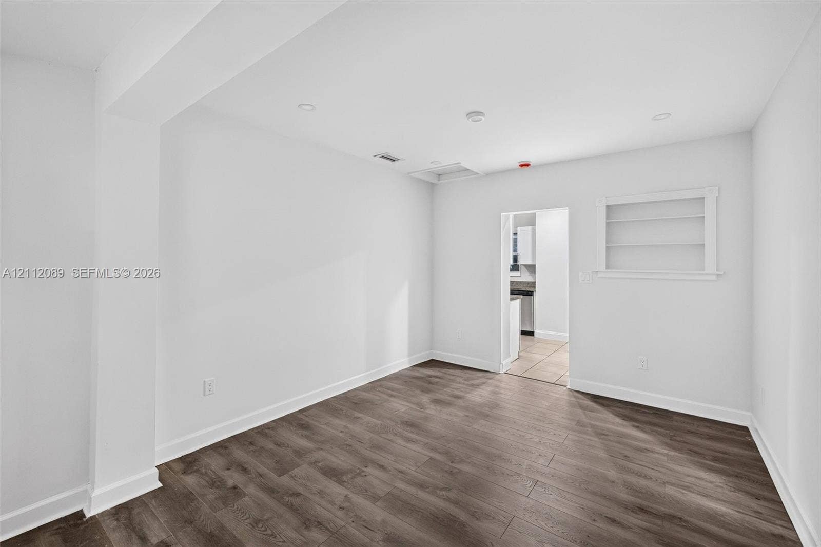 2017 NE 29th Court, Fort Lauderdale, FL 33306 Interior room featuring wood-finish flooring, recessed lighting, and built-in wall shelving