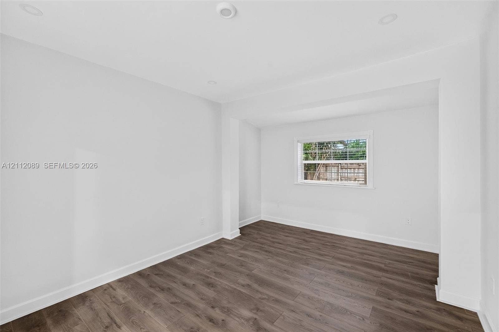 2017 NE 29th Court, Fort Lauderdale, FL 33306 Neutral interior featuring wood-finish flooring, recessed lighting, and a single-pane window