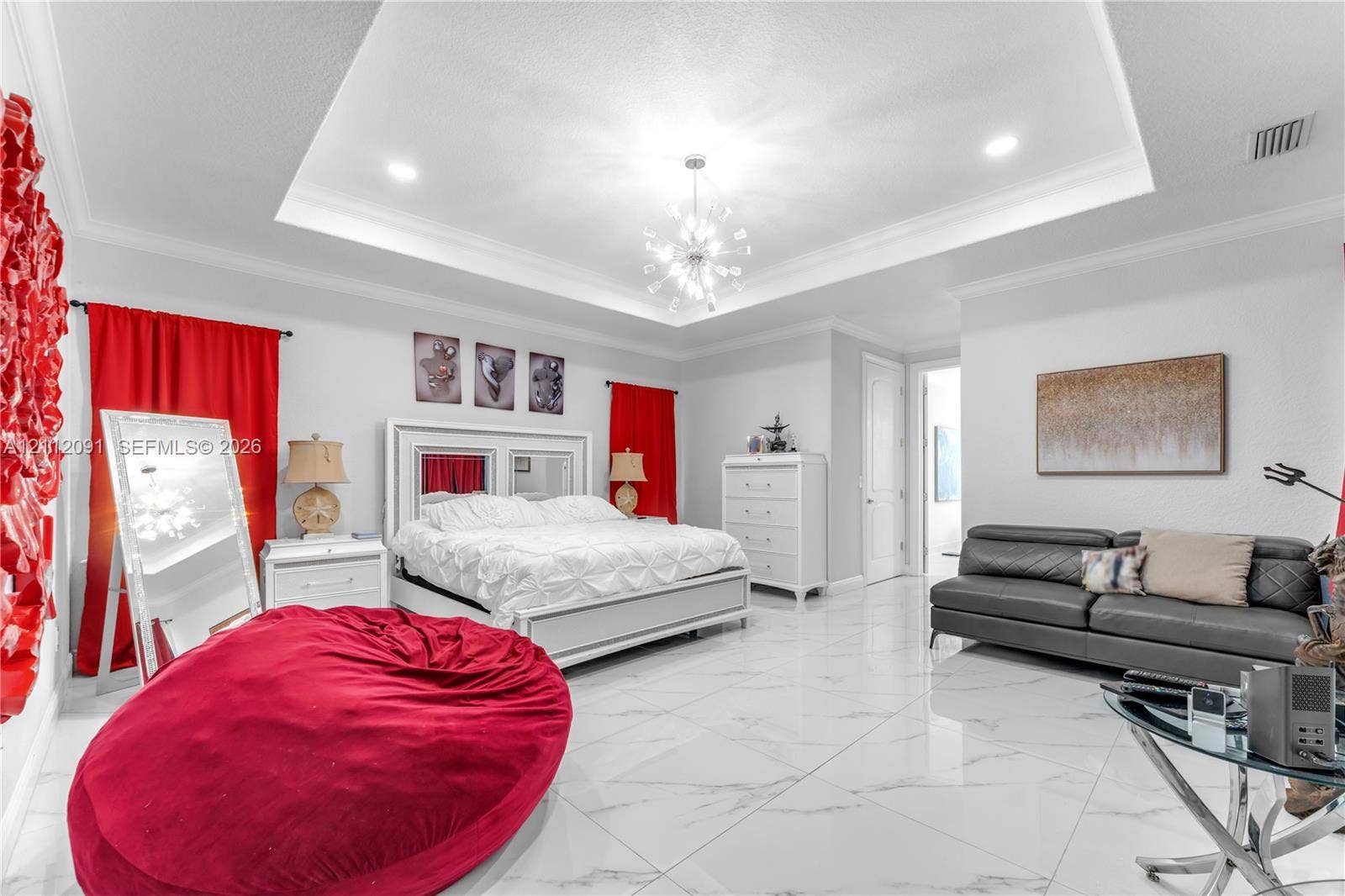 29481 SW 193rd Court, Homestead, FL 33030 Tray ceiling with recessed lighting, large-format tile flooring, and multi-arm chandelier