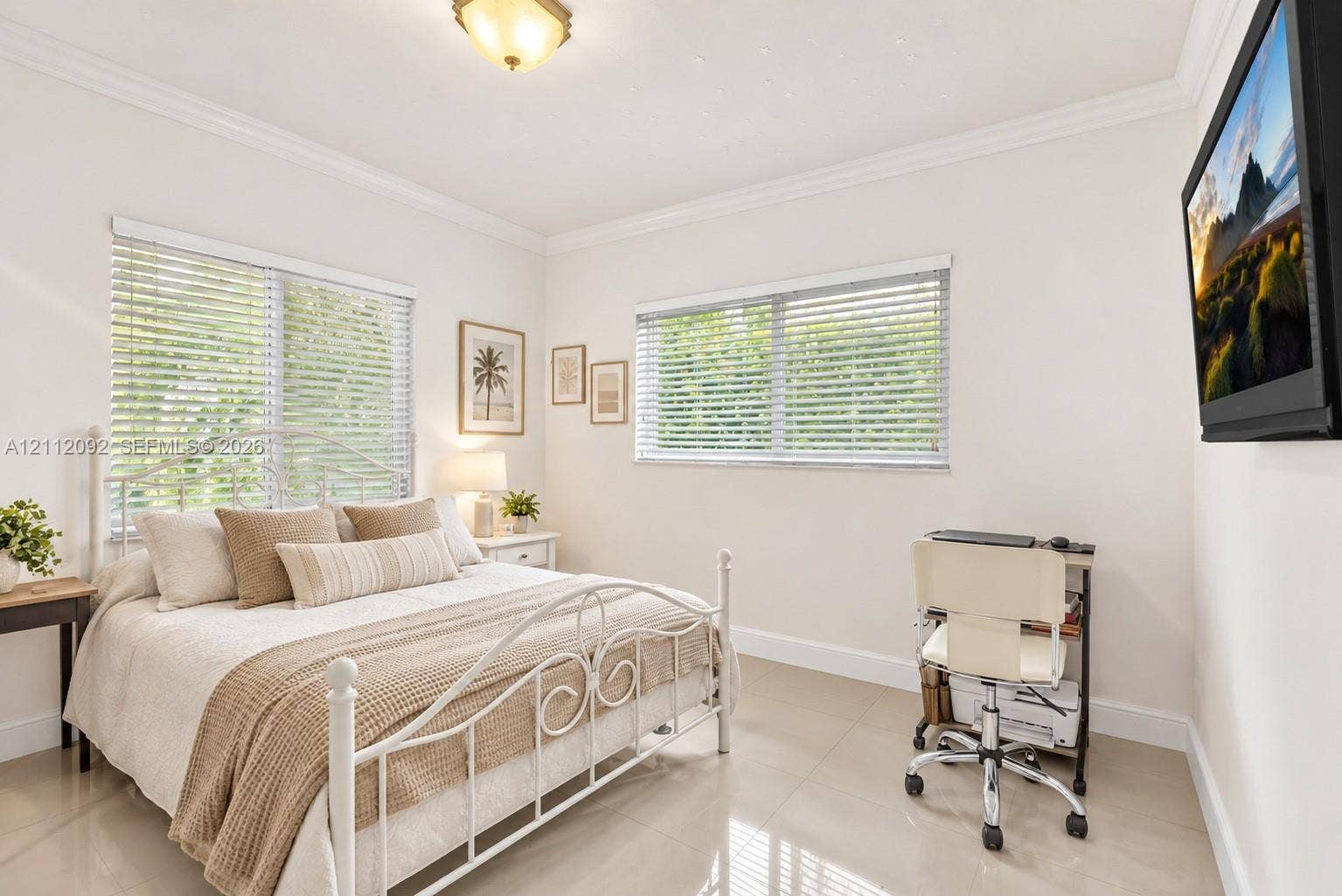 419 Sevilla Avenue, Coral Gables, FL 33134 Neutral-toned tile flooring, crown molding, and dual windows equipped with horizontal blinds