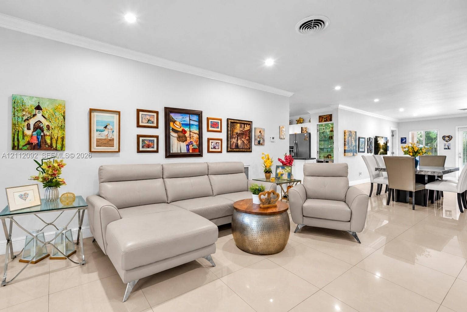 419 Sevilla Avenue, Coral Gables, FL 33134 Open-concept interior featuring large-format tile flooring, recessed lighting, and crown molding