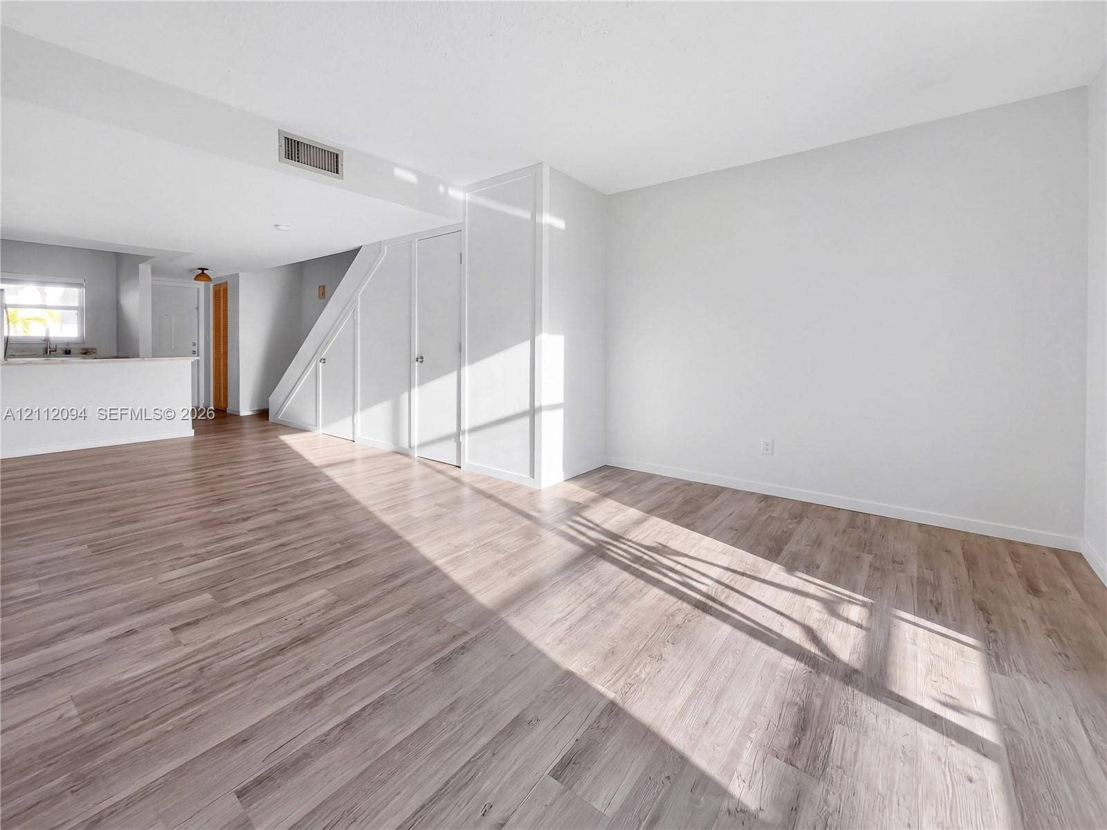 4600 SW 67th Avenue, #242, Miami, Miami, FL 33155 Interior featuring neutral wall paint, wood-finish flooring, and built-in closet storage