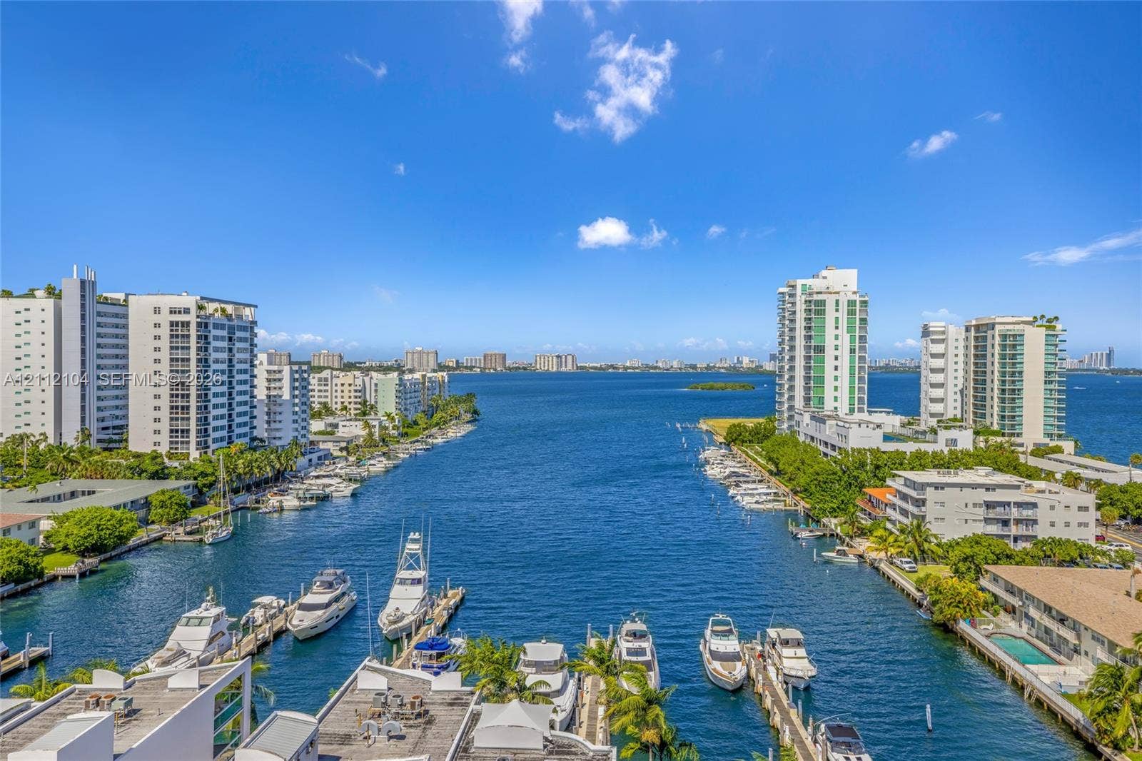 7900 Harbor Island Drive, #1203, North Bay Village, North Bay Village, FL 33141 Panoramic water expanse featuring a direct waterway channel, deep-water dockage, and coastal high-rise architecture