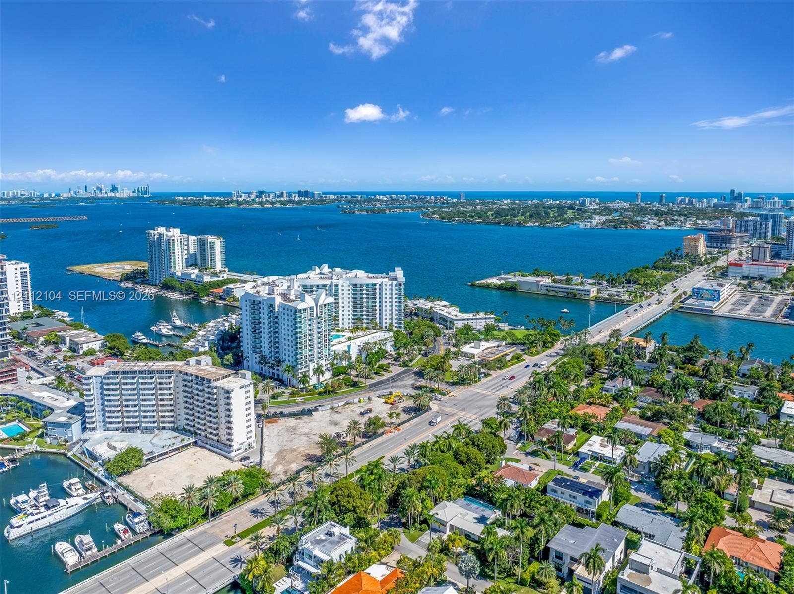 7900 Harbor Island Drive, #1203, North Bay Village, North Bay Village, FL 33141 Aerial perspective showcasing expansive water frontage, deep-water access, established palm tree canopy, and proximity to municipal infrastructure
