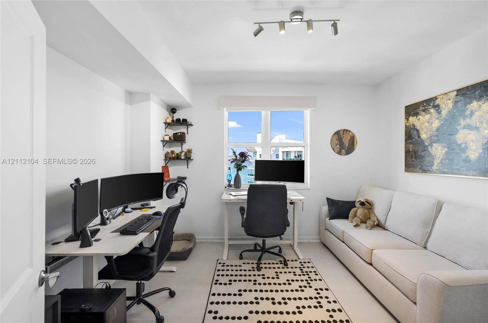 7900 Harbor Island Drive, #1203, North Bay Village, North Bay Village, FL 33141 Multi-purpose room featuring a multi-light directional ceiling fixture, window with natural lighting, and wall-mounted shelving