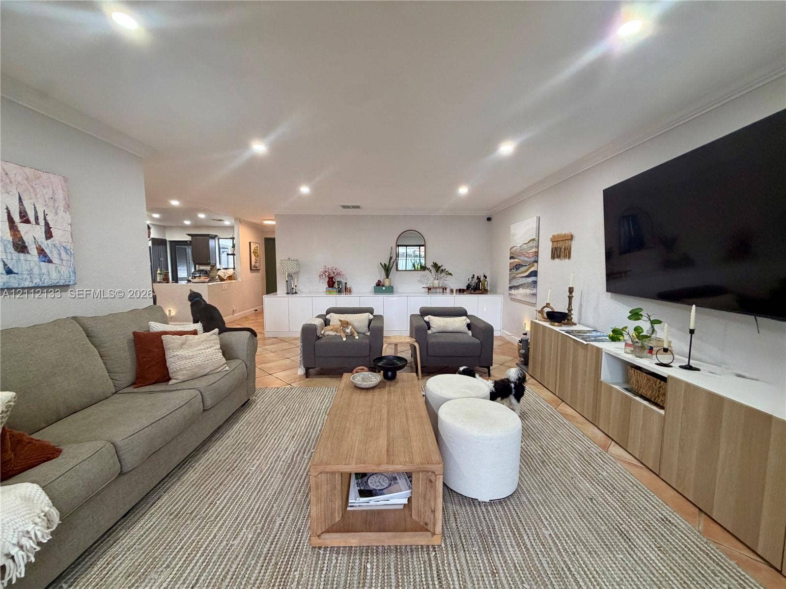 407 Bonnie Brae Way, #22, Hollywood, Hollywood, FL 33021 Living area featuring recessed lighting, tile flooring, and custom built-in cabinetry with wood-grain finish doors