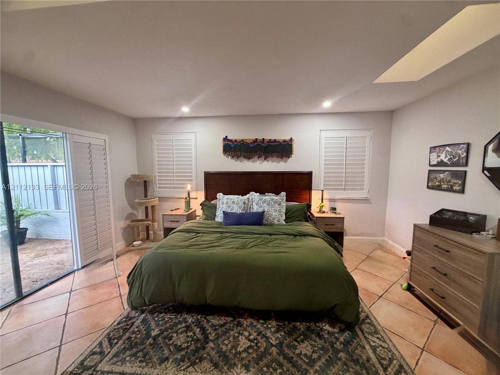 407 Bonnie Brae Way, #22, Hollywood, Hollywood, FL 33021 Tile flooring, plantation shutters, recessed ceiling lighting, and sliding glass doors