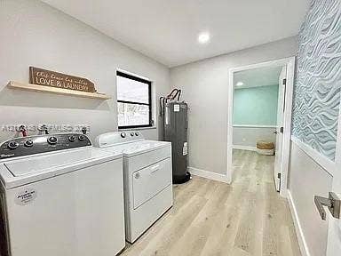 1753 N 16th Court N, Lake Worth, Lake Worth, FL 33460 Laundry room featuring wood-finish flooring, recessed lighting, and textured accent wall covering