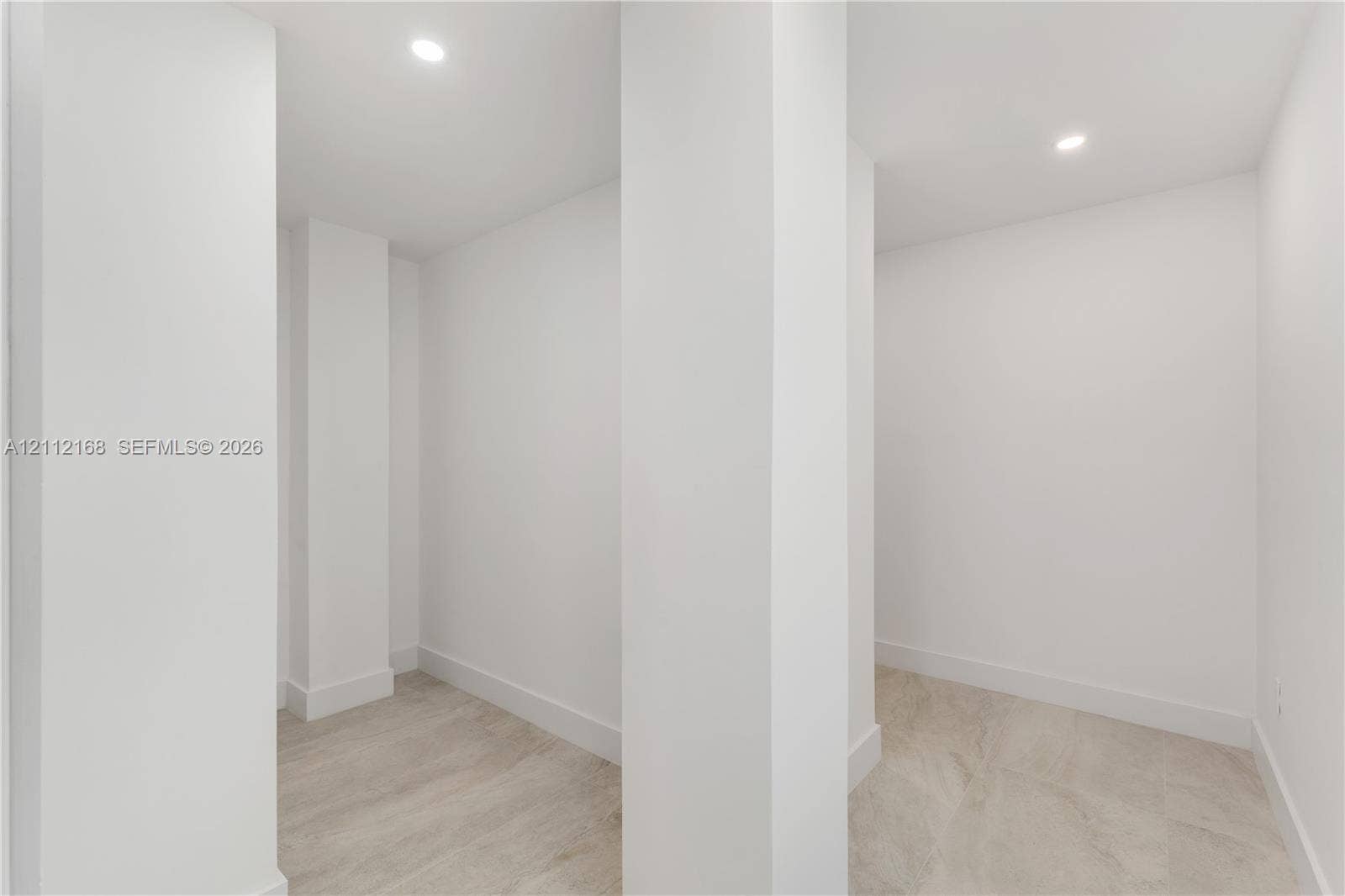 1041 E Buttonwood Drive, Sugarloaf Key, FL 33042 Interior space featuring neutral wall tones, recessed lighting, and wood-finish flooring