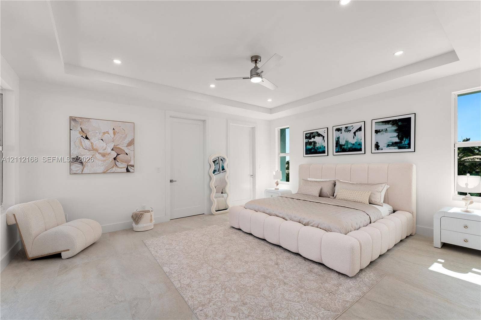 1041 E Buttonwood Drive, Sugarloaf Key, FL 33042 Spacious interior featuring a tray ceiling, recessed lighting, neutral large-format tile flooring, and a modern ceiling fan