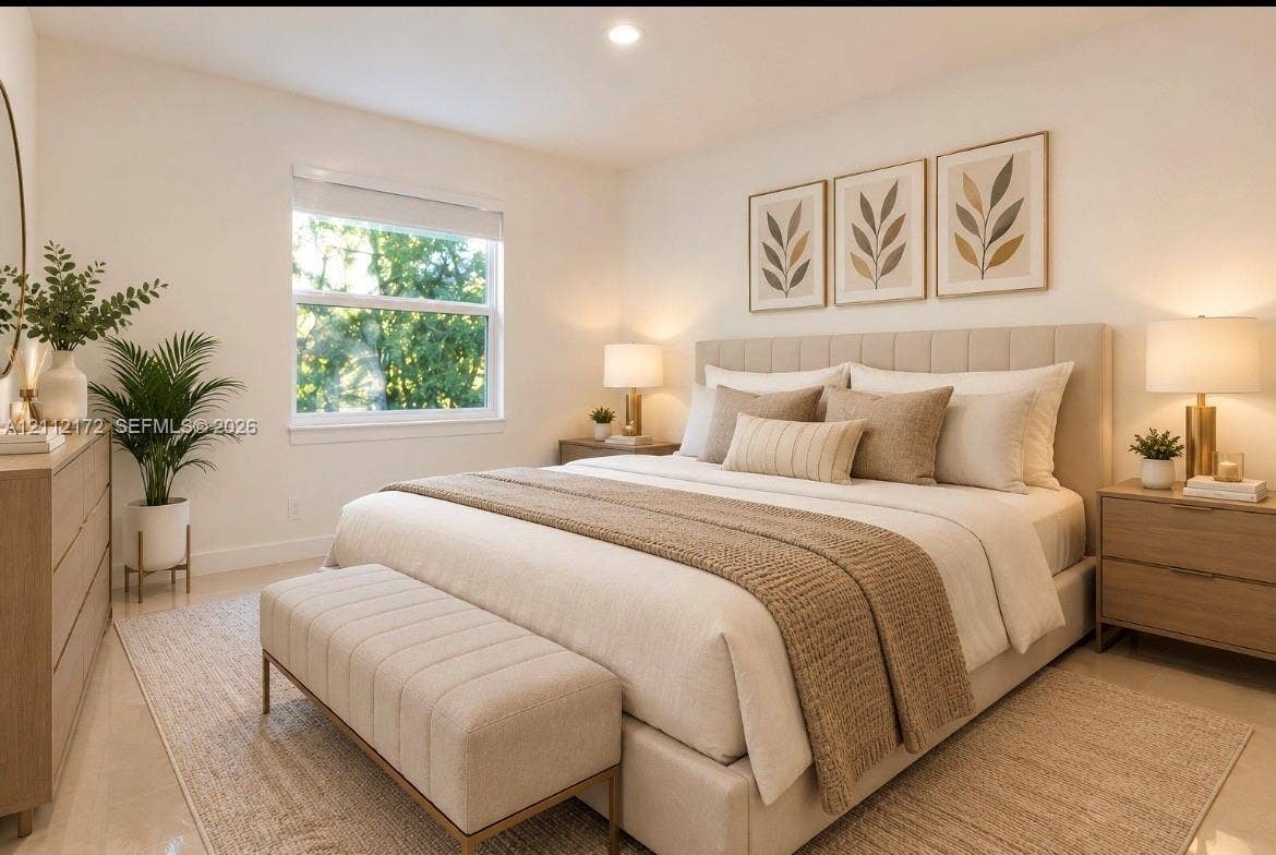 Bedroom featuring recessed ceiling lighting, neutral wall paint, and window with natural light