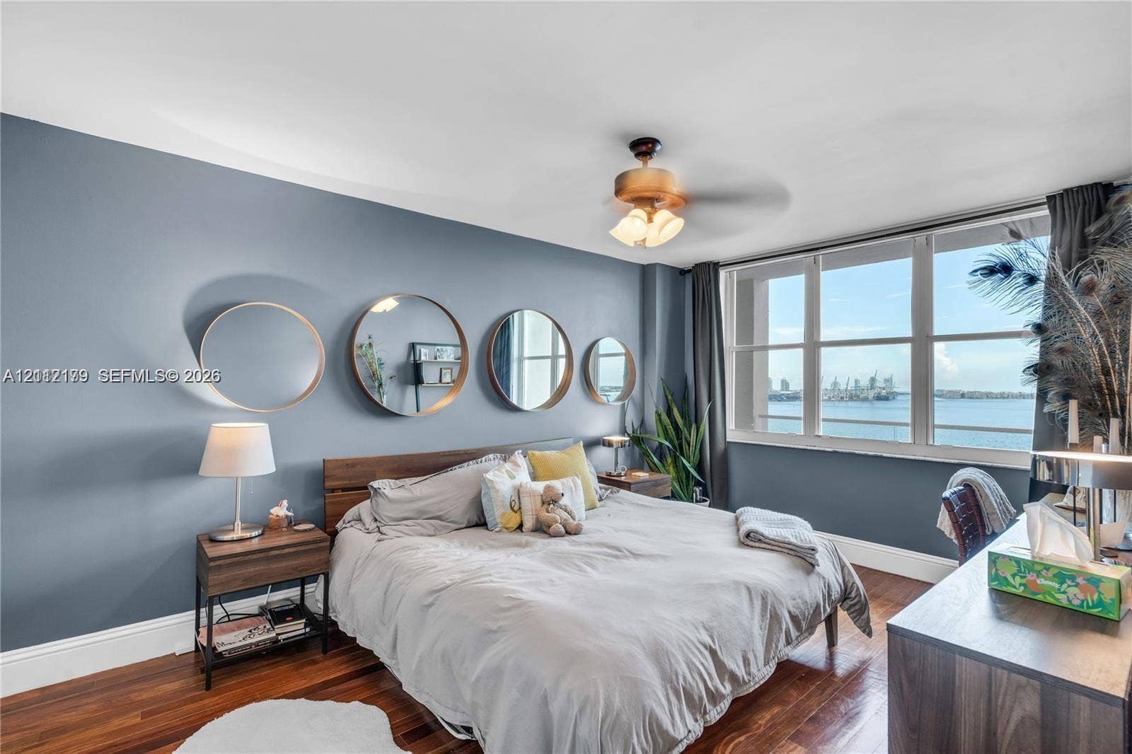 800 Claughton Island Drive, #1604, Miami, Miami, FL 33131 Room featuring wood-finish flooring, large floor-to-ceiling windows, and a ceiling-mounted light fixture with a fan
