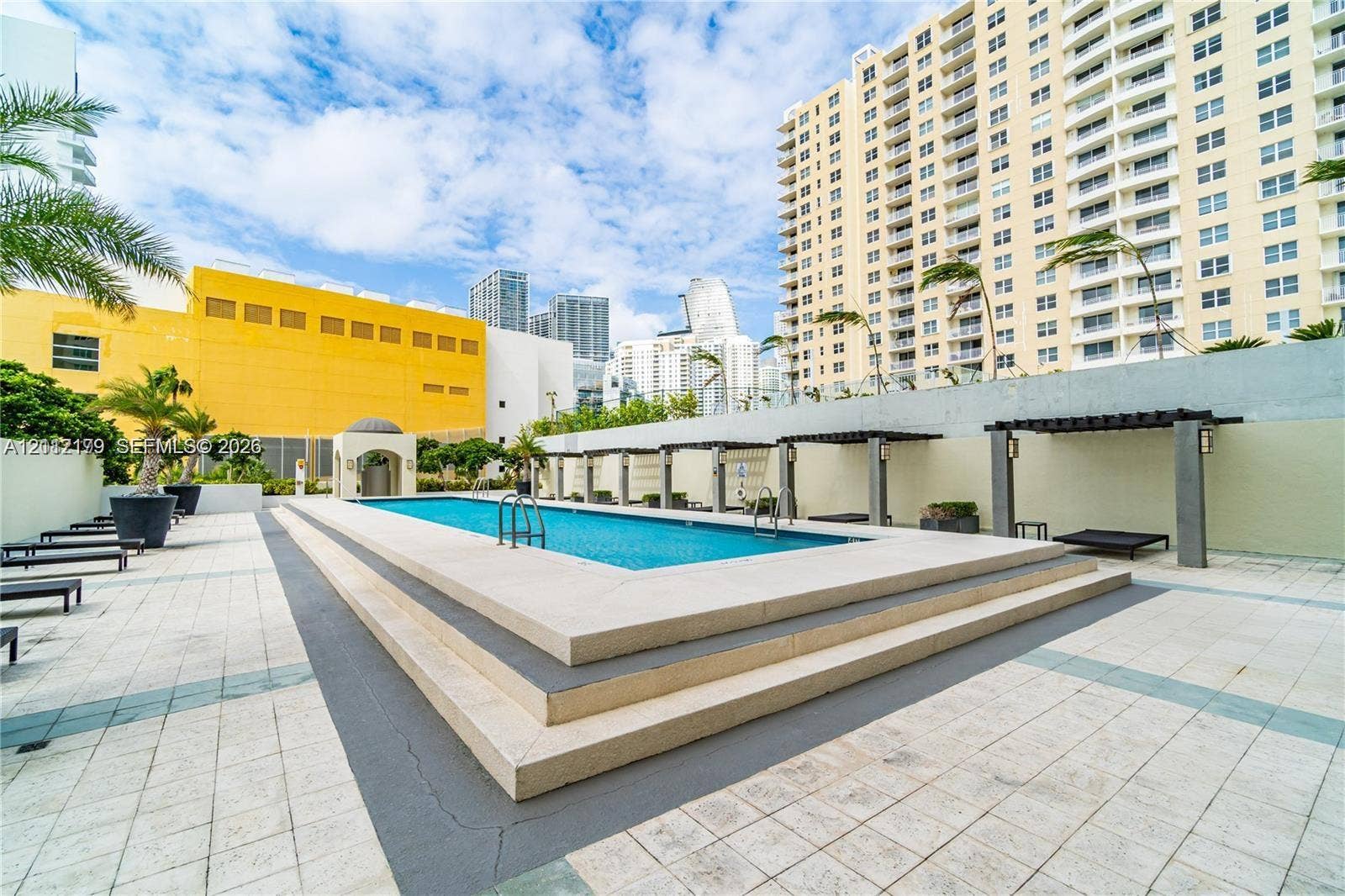 800 Claughton Island Drive, #1604, Miami, Miami, FL 33131 Swimming pool with stepped stone perimeter, tile decking, and built-in pergola structures