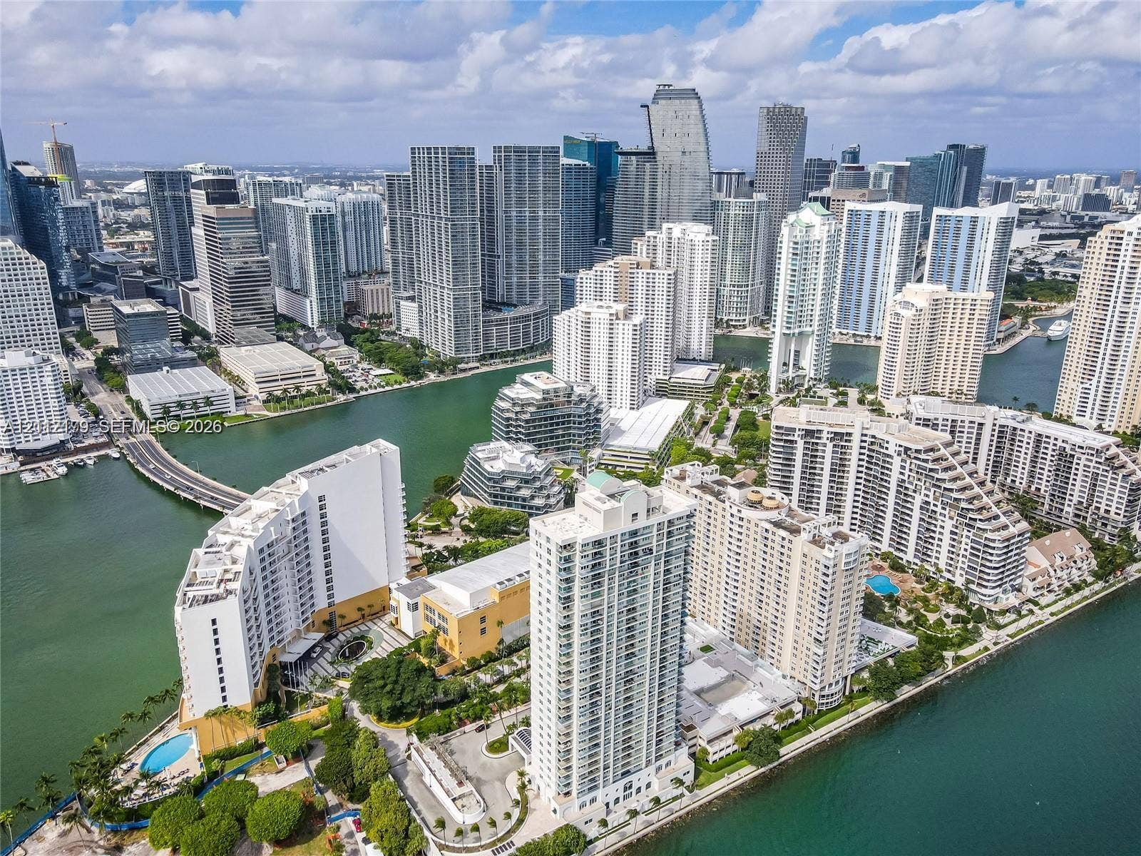 800 Claughton Island Drive, #1604, Miami, Miami, FL 33131 Aerial perspective of a high-density urban waterfront district featuring multiple high-rise structures, inland waterways, a bridge, and surrounding coastal infrastructure