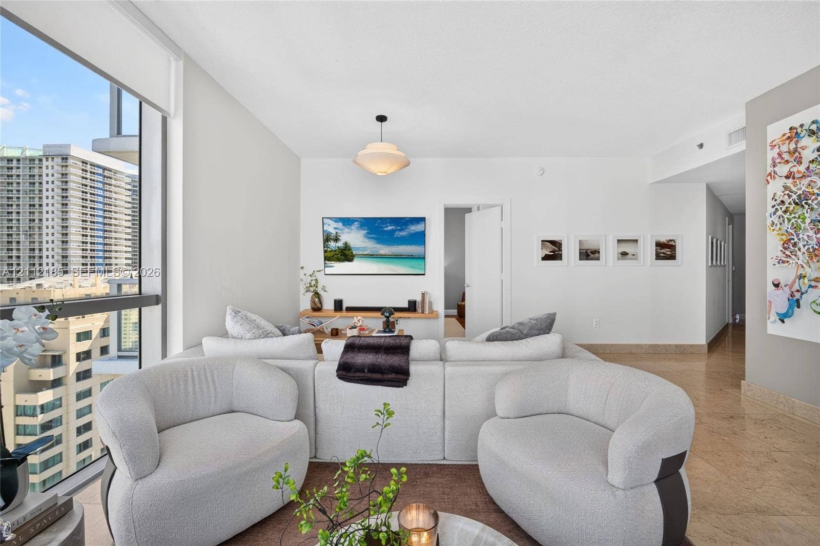 1060 Brickell Avenue, #2401, Miami, FL 33131 Floor-to-ceiling windows, polished stone flooring, recessed lighting, and a neutral color palette