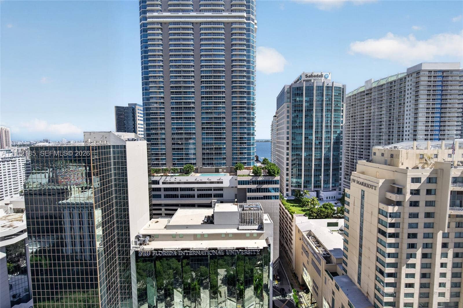 1060 Brickell Avenue, #2401, Miami, FL 33131 High-rise urban landscape featuring glass-clad commercial architecture and densely developed metropolitan surroundings