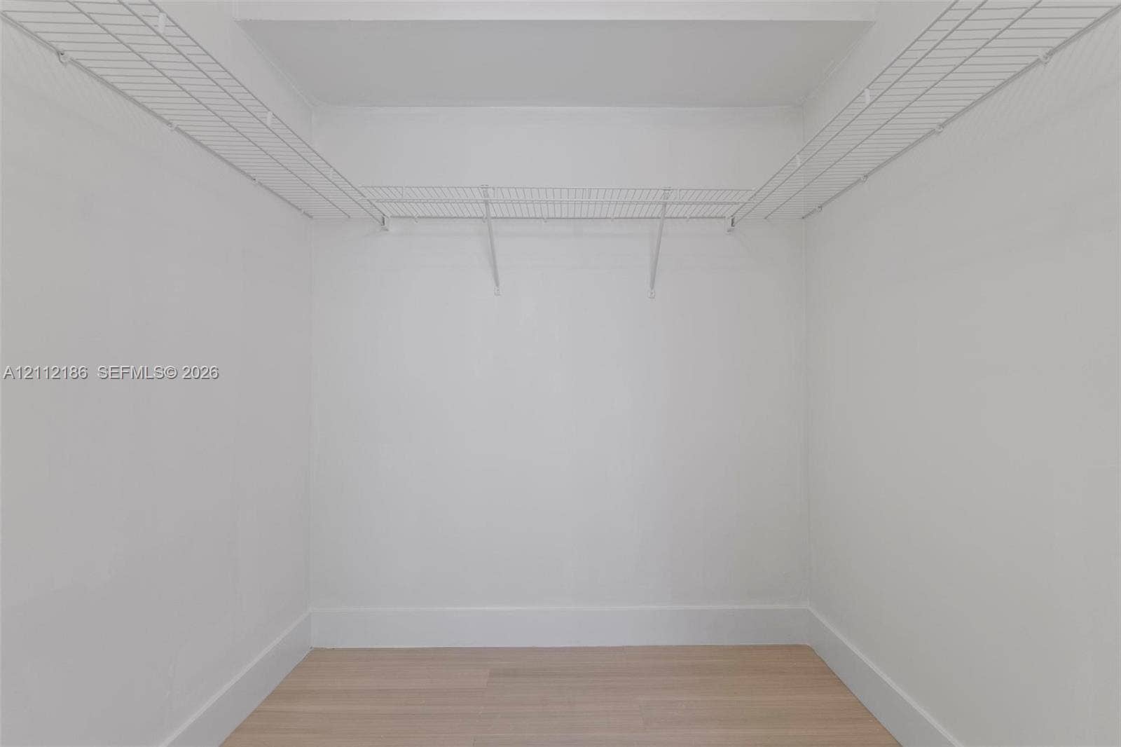 1300 SW 124th Terrace, #107P, Pembroke Pines, Pembroke Pines, FL 33027 Storage space featuring white walls, wood-finish flooring, and white wire shelving