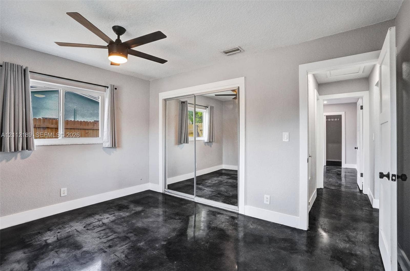 5161 SW 7th Court, #0, Margate, Margate, FL 33068 Polished concrete flooring, ceiling fan with integrated lighting, and mirrored sliding closet doors