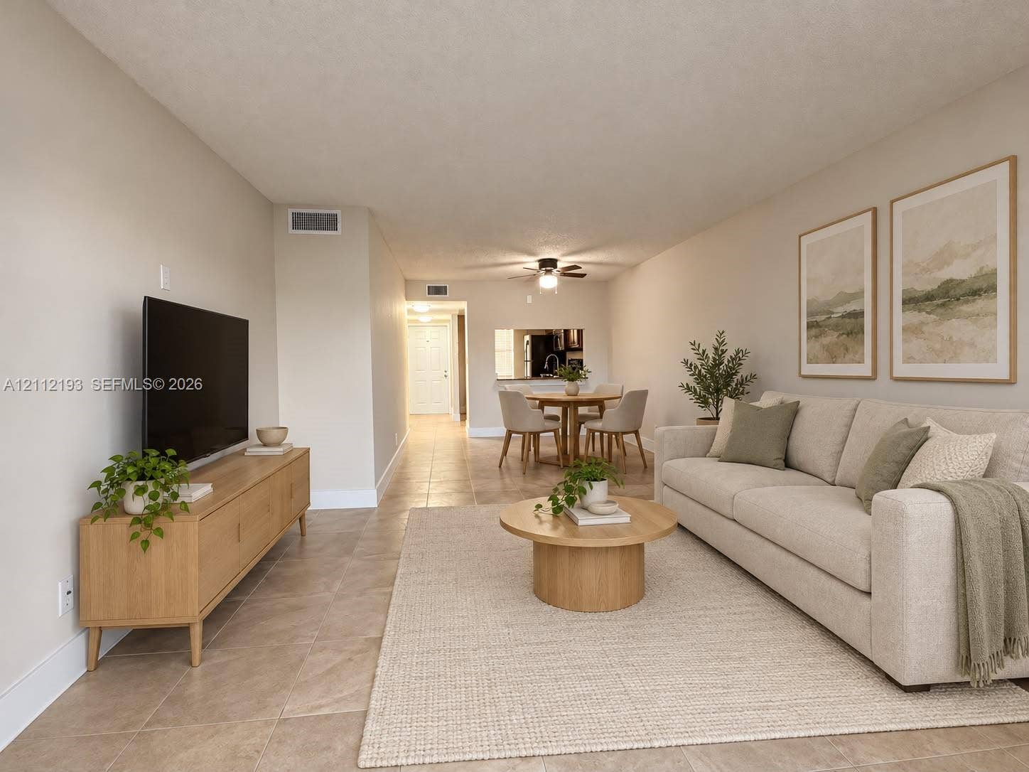 10013 Winding Lake Road, #106, Sunrise, Sunrise, FL 33351 Neutral ceramic tile flooring and ceiling-mounted light fixture with integrated fan