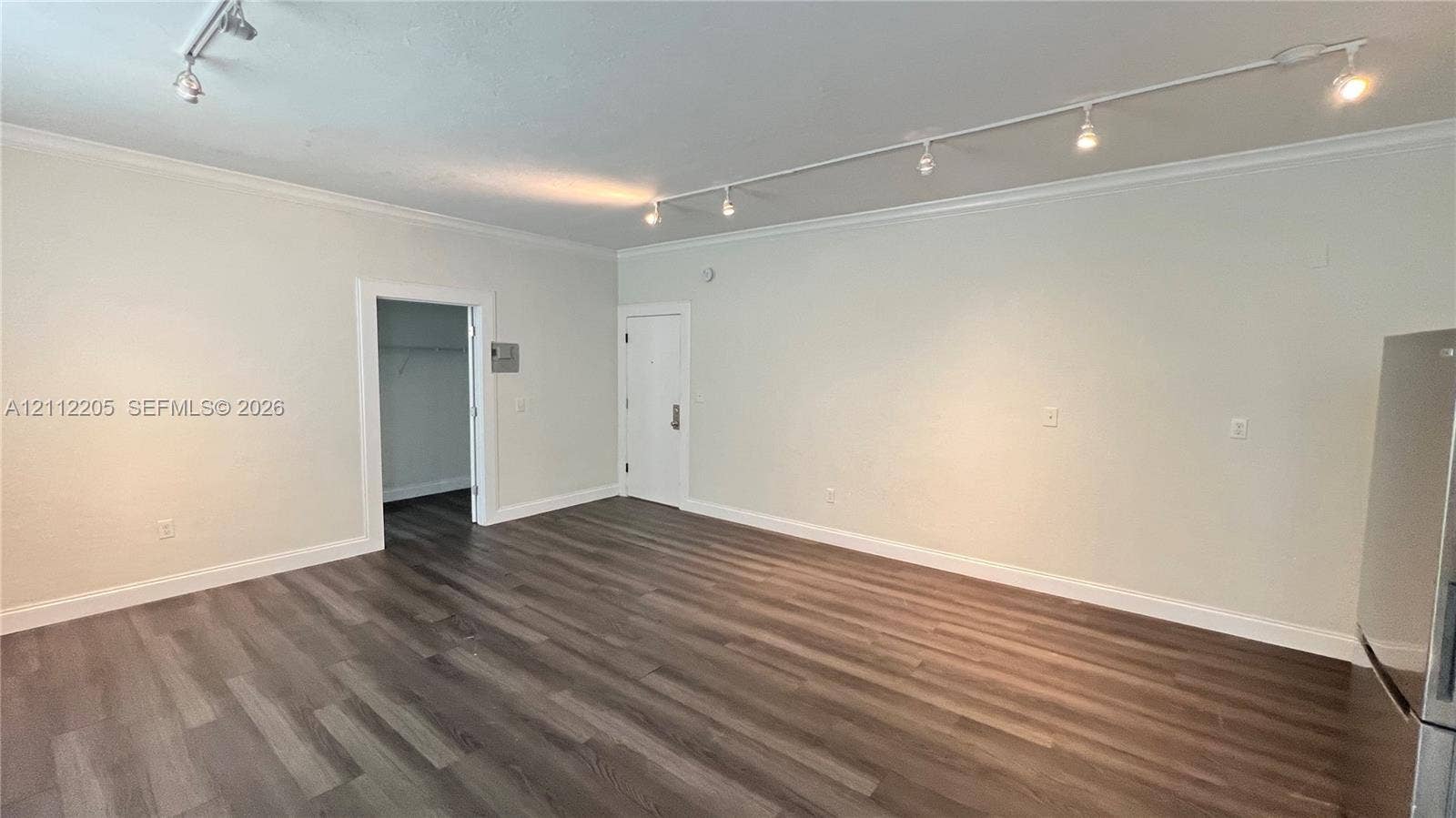 1115 Euclid Avenue, #5, Miami Beach, Miami Beach, FL 33139 Wood-finish flooring, adjustable track lighting, neutral wall palette, and crown molding