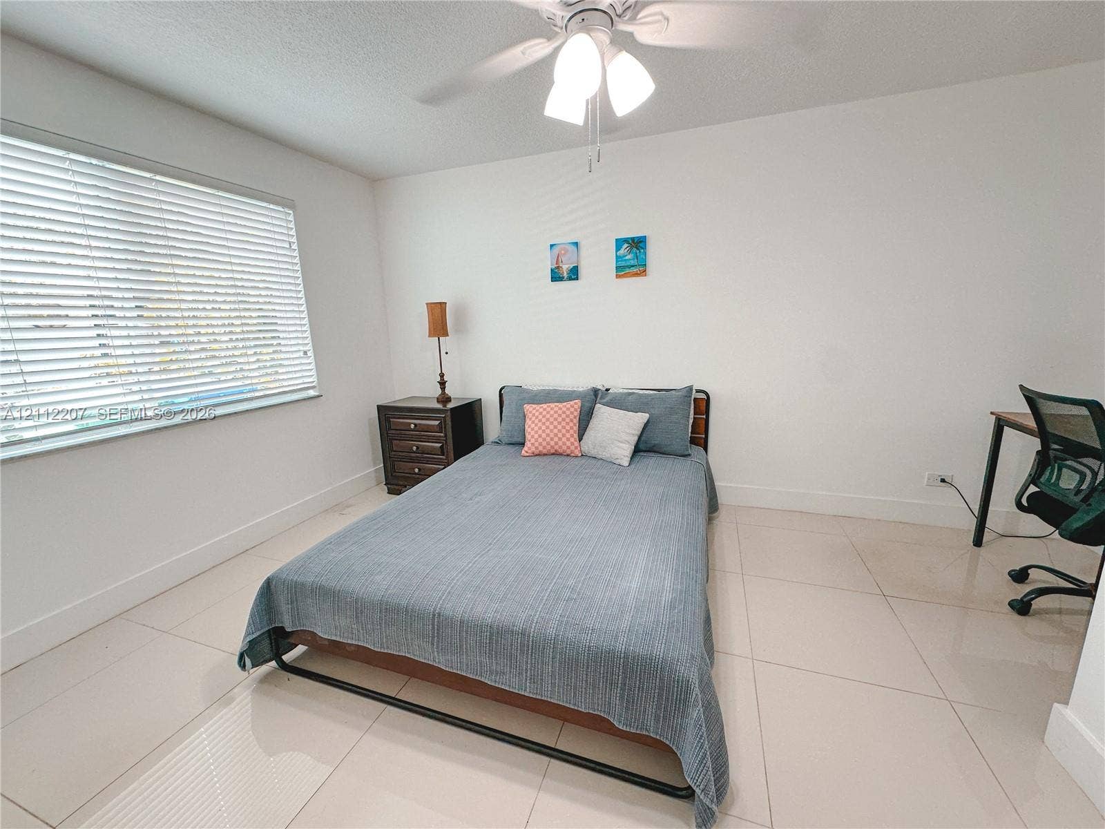 525 SW 67th Avenue, Miami, Miami, FL 33144 Room featuring large-format tile flooring, a multi-blade ceiling fan with integrated light fixture, and horizontal window blinds