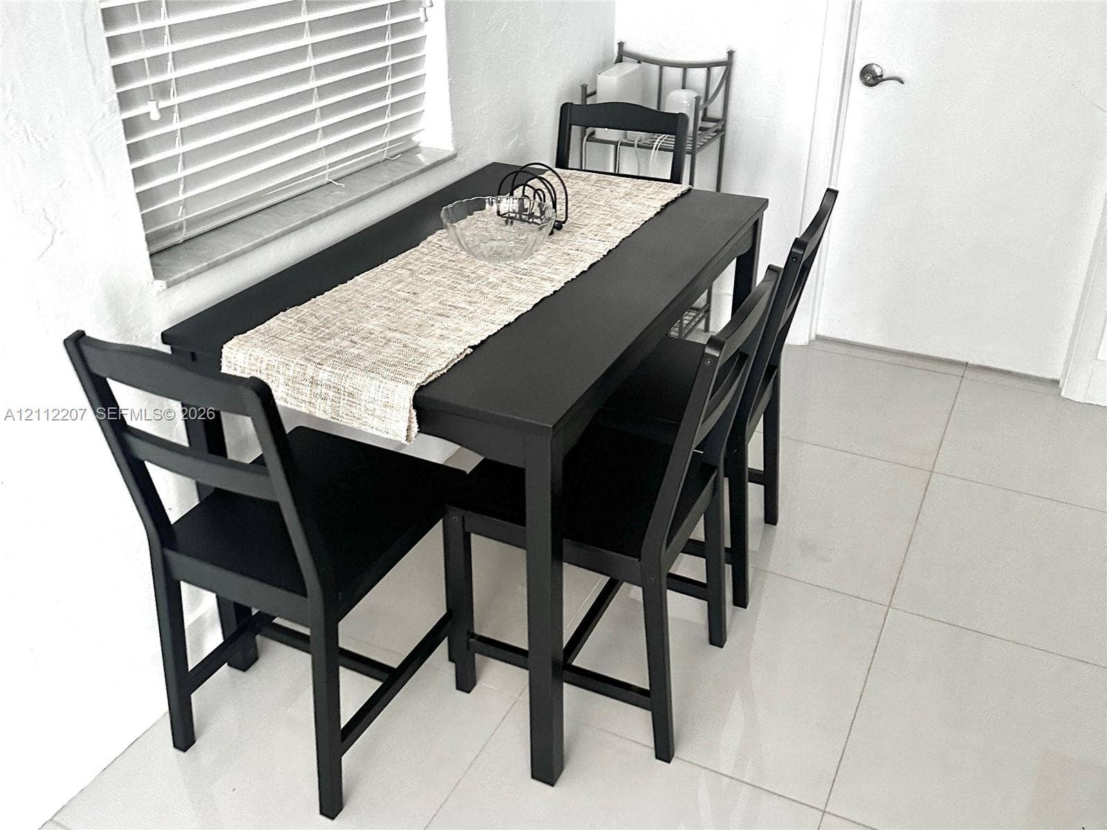 525 SW 67th Avenue, Miami, Miami, FL 33144 Large-format tile flooring, horizontal slat window blinds, and a neutral wall finish