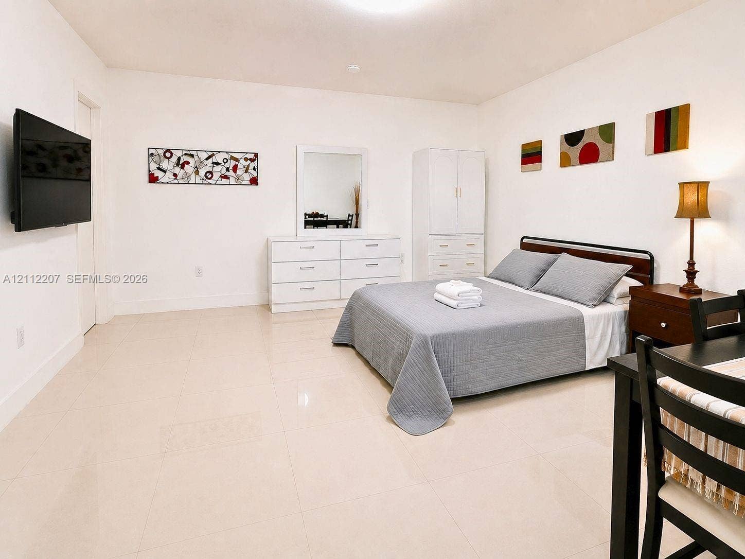 525 SW 67th Avenue, Miami, Miami, FL 33144 Spacious interior featuring large-format ceramic tile flooring and smooth, neutral-painted wall surfaces