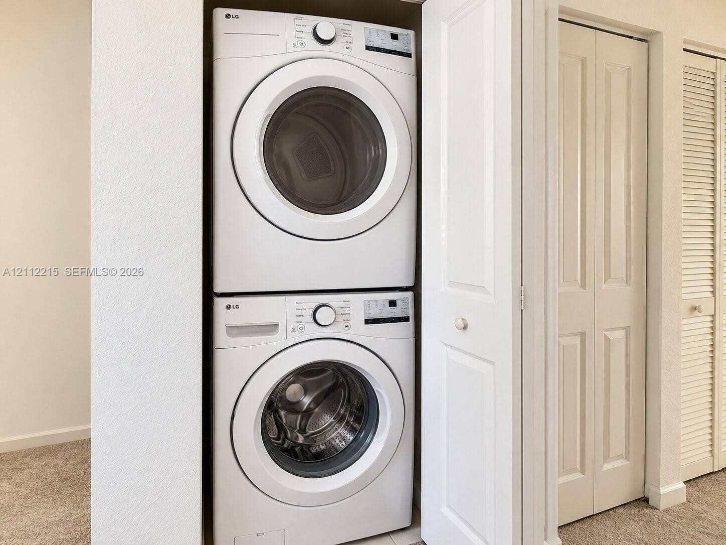 1161 SE 1 Street, #0, Florida City, Florida City, FL 33034 Stacked front-loading washer and dryer unit housed within a dedicated closet featuring bifold doors
