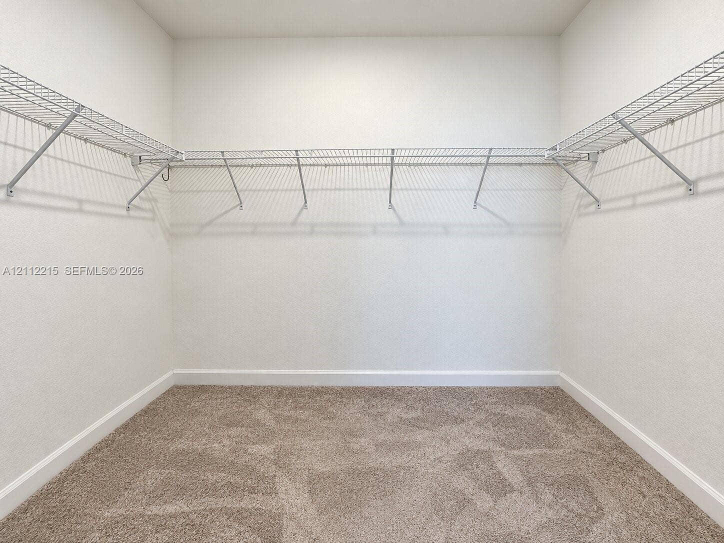 1161 SE 1 Street, #0, Florida City, Florida City, FL 33034 Walk-in storage space featuring neutral carpeting and wrap-around white wire shelving