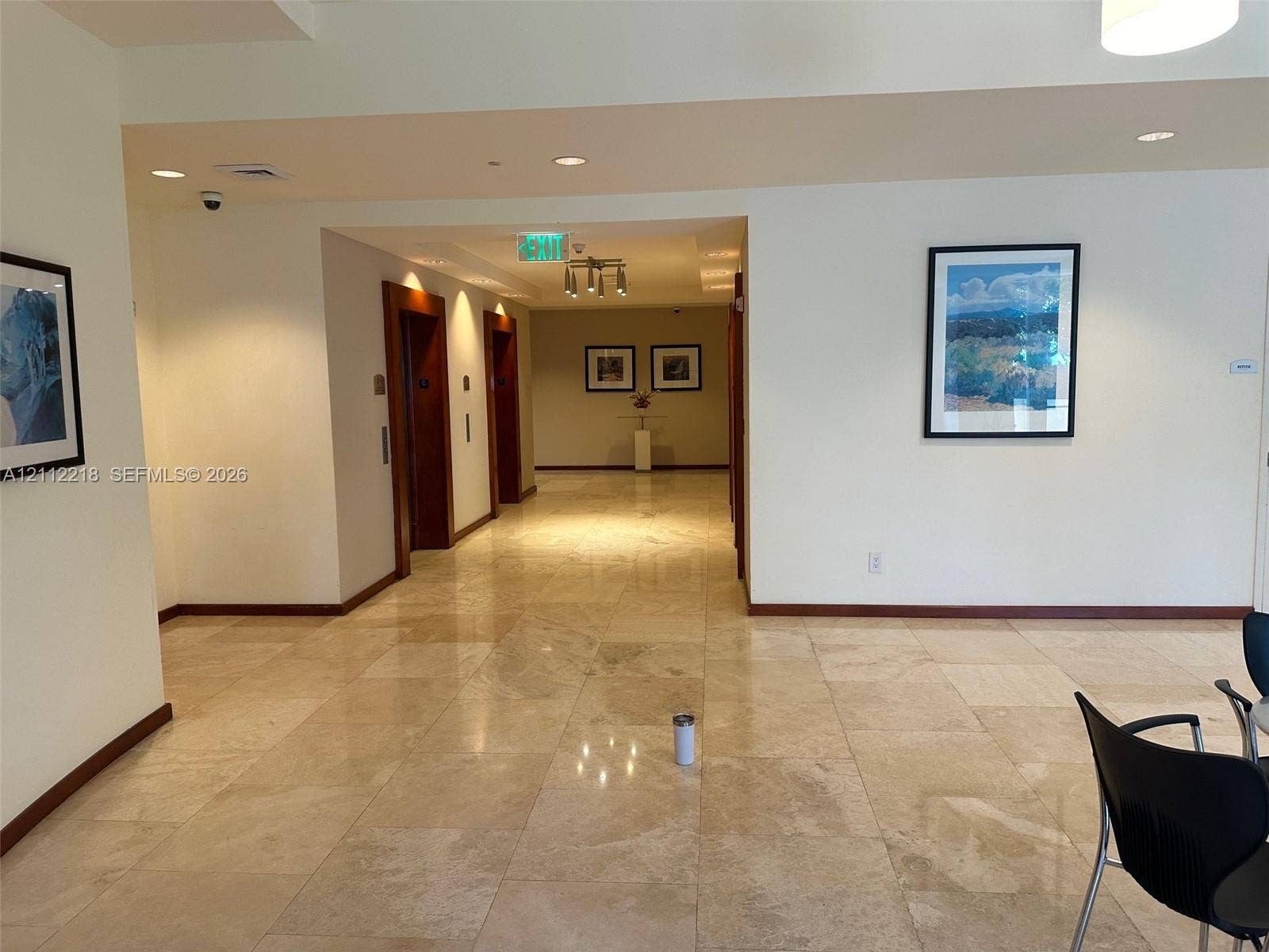 2475 Brickell Avenue, #1905, Miami, Miami, FL 33129 Large-format stone flooring throughout the common area, recessed ceiling lighting, and wood-trim elevator surrounds