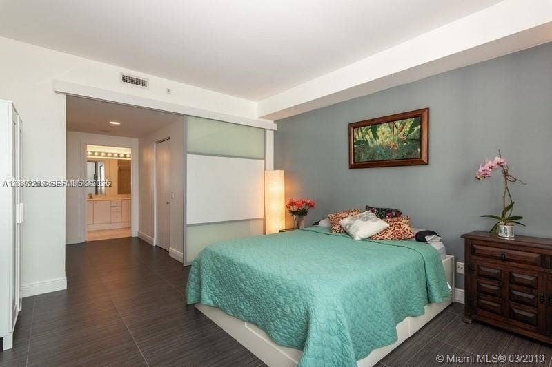 2475 Brickell Avenue, #1905, Miami, Miami, FL 33129 Dark-toned tile flooring, translucent sliding glass panel room divider, and high ceilings