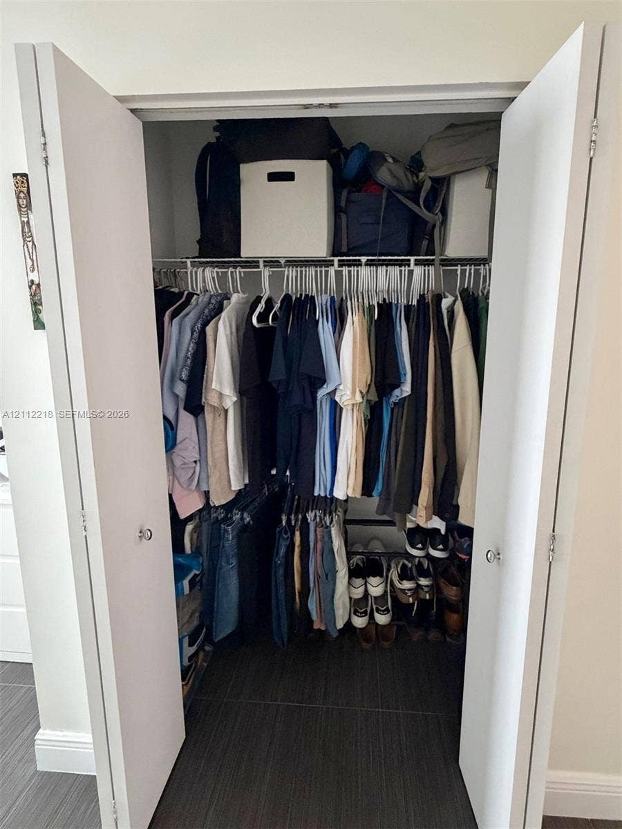 2475 Brickell Avenue, #1905, Miami, Miami, FL 33129 Reach-in closet featuring dual white hinged doors and integrated wire shelving