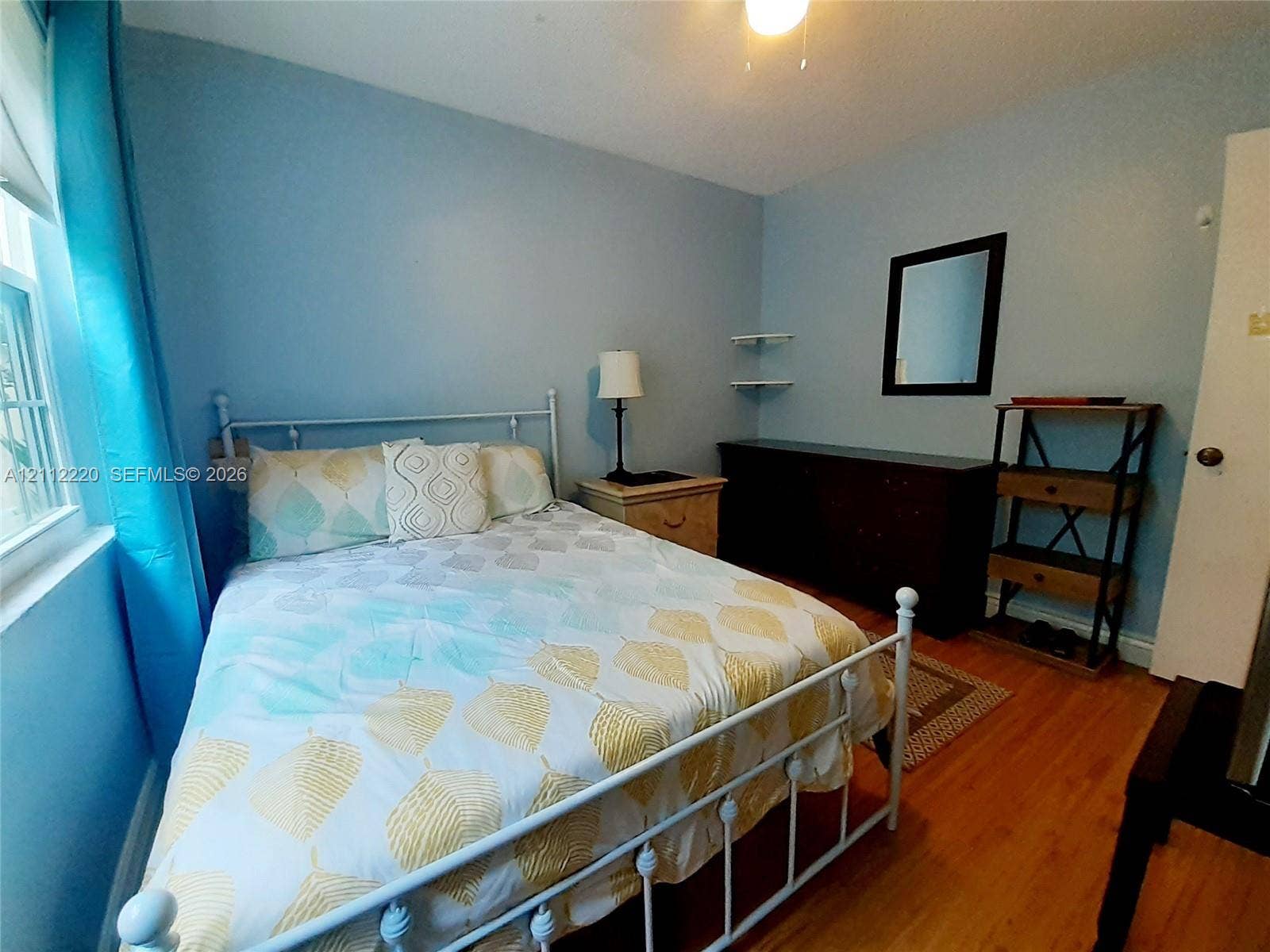 508 W Westree Lane, #508, Plantation, Plantation, FL 33324 Wood-finish flooring, two wall-mounted corner shelves, and ceiling-mounted light fixture