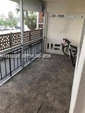1450 NE 170th Street, #210, North Miami Beach, North Miami Beach, FL 33162 Screened-in balcony featuring tile flooring and decorative lattice railing