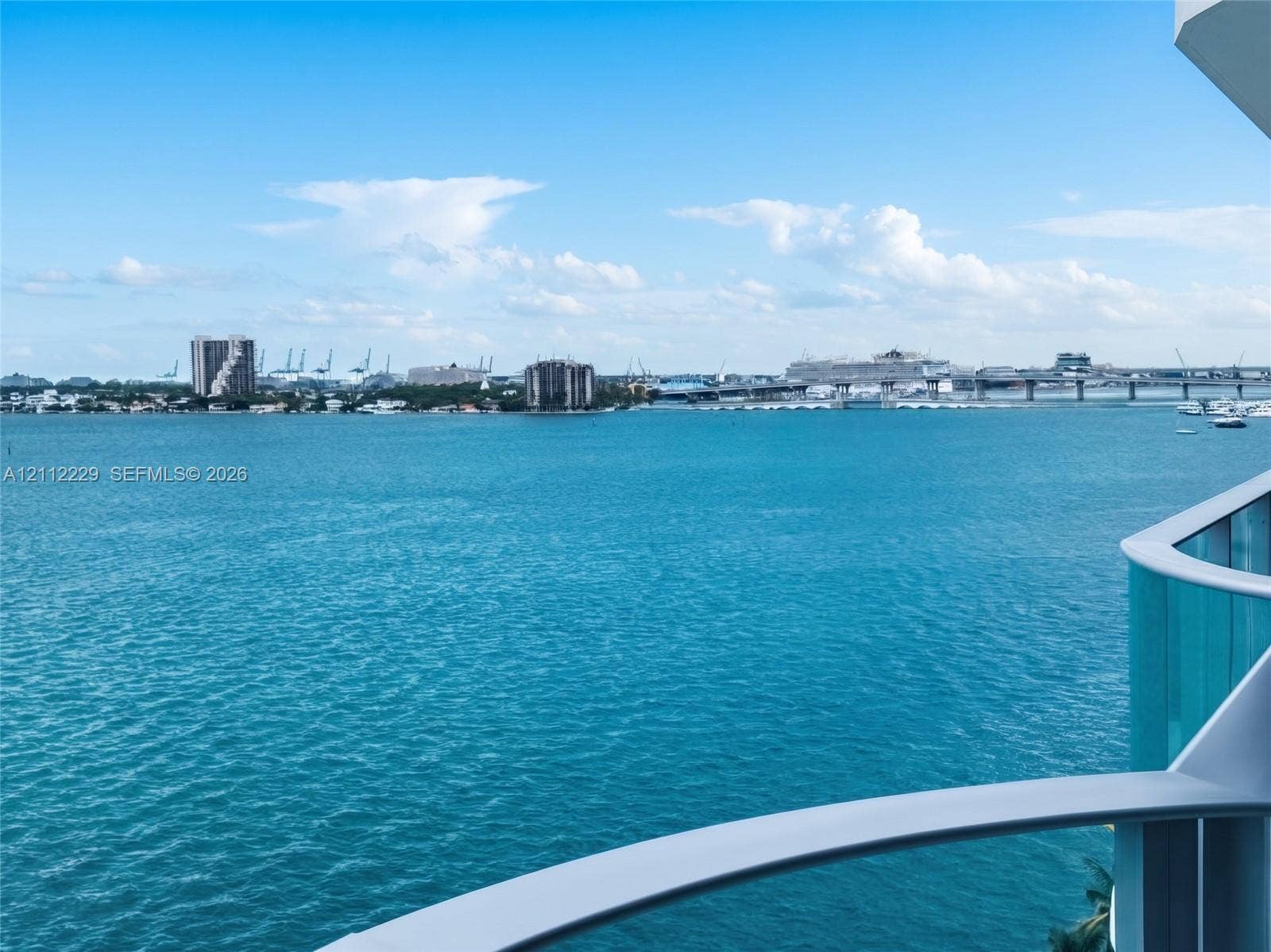 725 NE 24th Street, #706, Miami, Miami, FL 33137 Balcony featuring a glass railing and expansive water horizon
