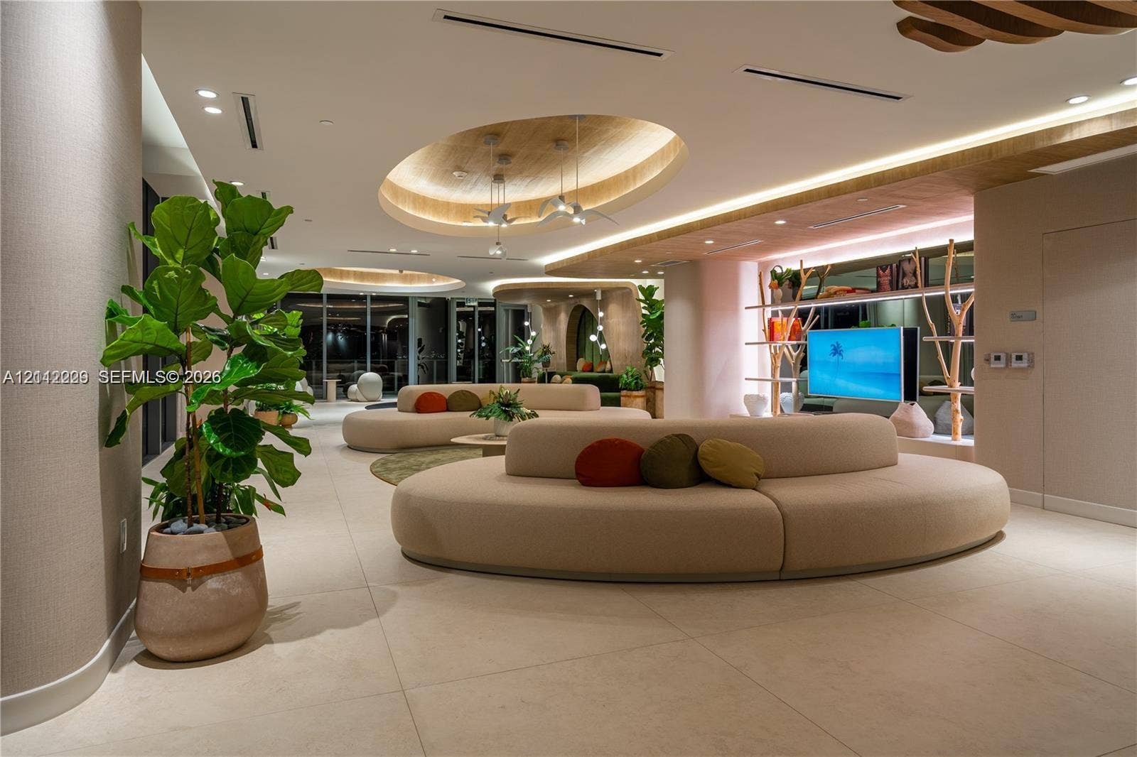 725 NE 24th Street, #706, Miami, Miami, FL 33137 Large-format tile flooring, recessed oval tray ceilings with integrated ambient lighting, and built-in display shelving