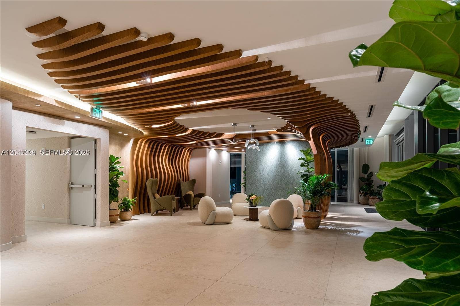 725 NE 24th Street, #706, Miami, Miami, FL 33137 Architectural ceiling feature composed of organic, suspended wooden slats, large-format tile flooring, textured accent wall, and recessed perimeter lighting