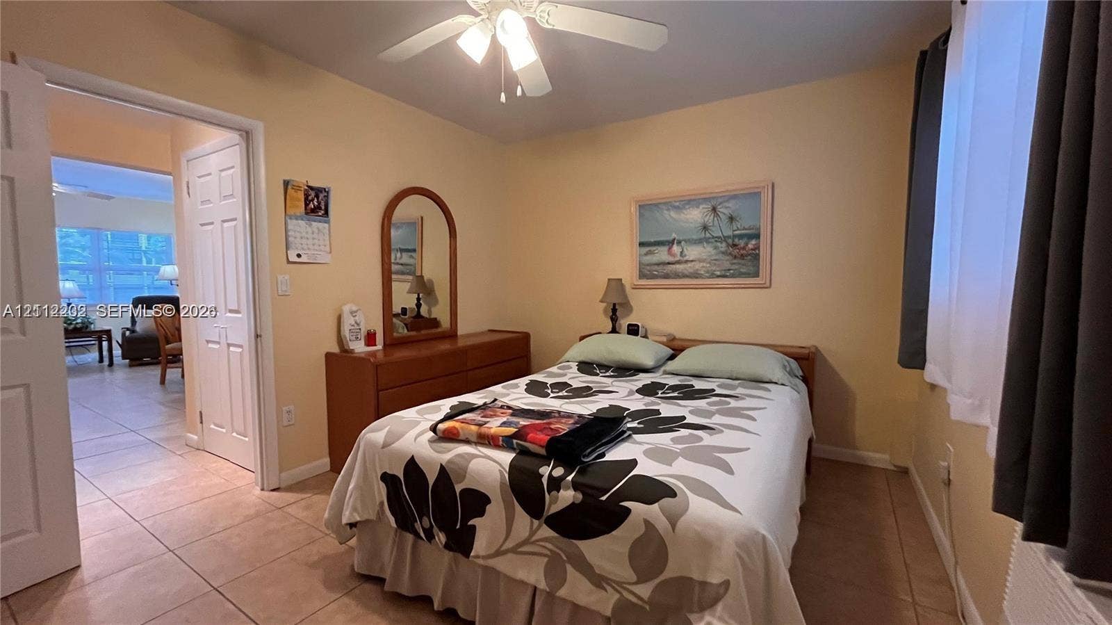 2001 S Ocean Drive, #55, Hallandale Beach, Hallandale Beach, FL 33009 Ceramic tile flooring, white-panel interior doors, and a ceiling-mounted light fixture with fan