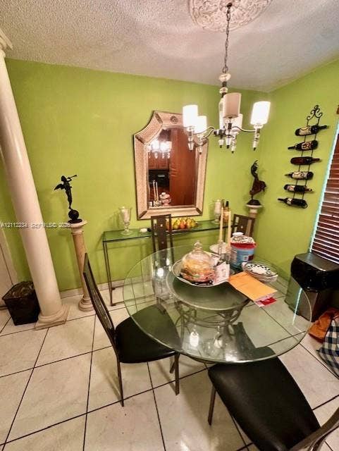 820 Salzedo Street, #305, Coral Gables, FL 33134 Dining space featuring tile flooring, a prominent architectural column, and a ceiling medallion with a multi-arm light fixture