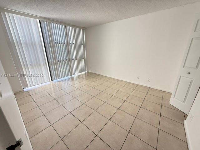 17011 N Bay Road, #415, Sunny Isles Beach, Sunny Isles Beach, FL 33160 Floor-to-ceiling sliding glass doors, neutral tile flooring, and a multi-panel interior door