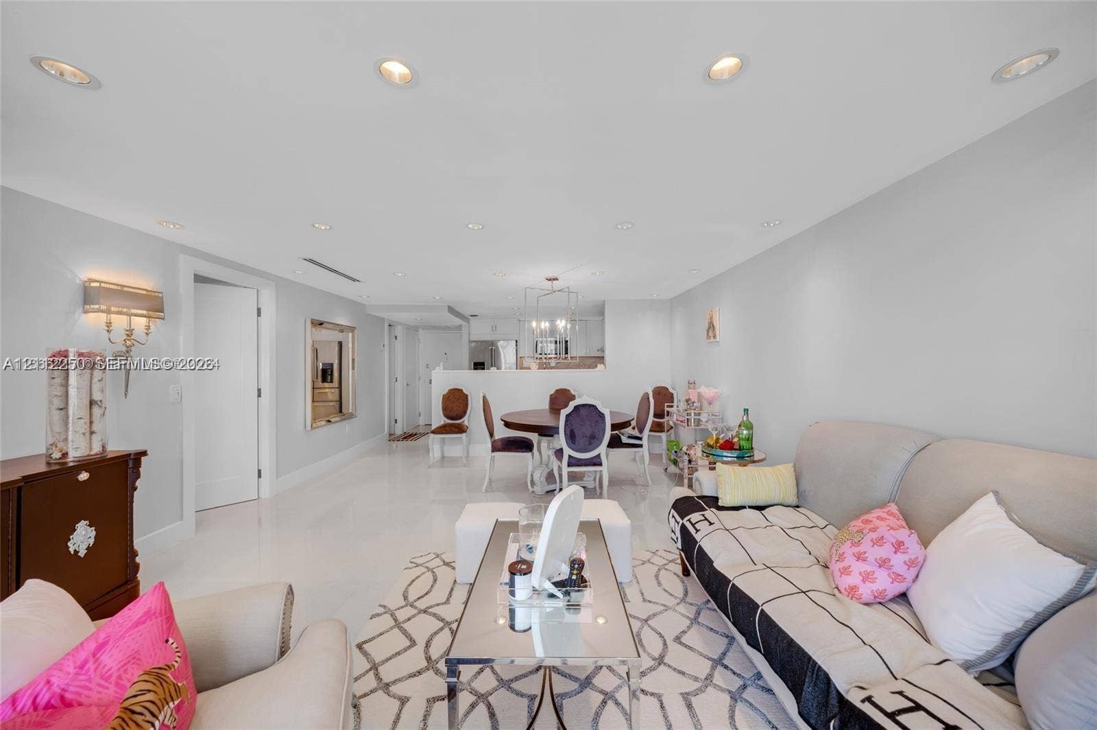5838 Collins Avenue, #2F, Miami Beach, FL 33140 Open-concept interior featuring high-gloss flooring, recessed lighting, and a modern light fixture