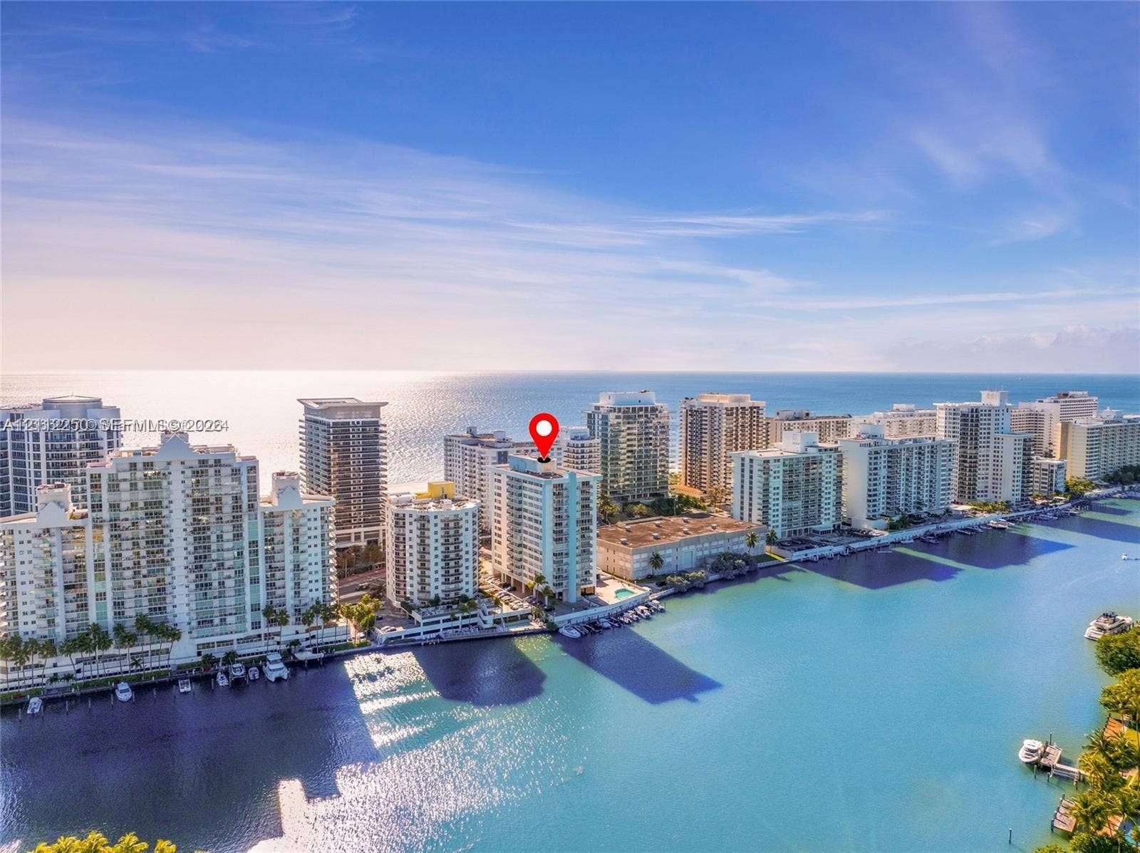 5838 Collins Avenue, #2F, Miami Beach, FL 33140 High-rise residential building featuring expansive water frontage, deep-water canal access, and immediate proximity to the coastline