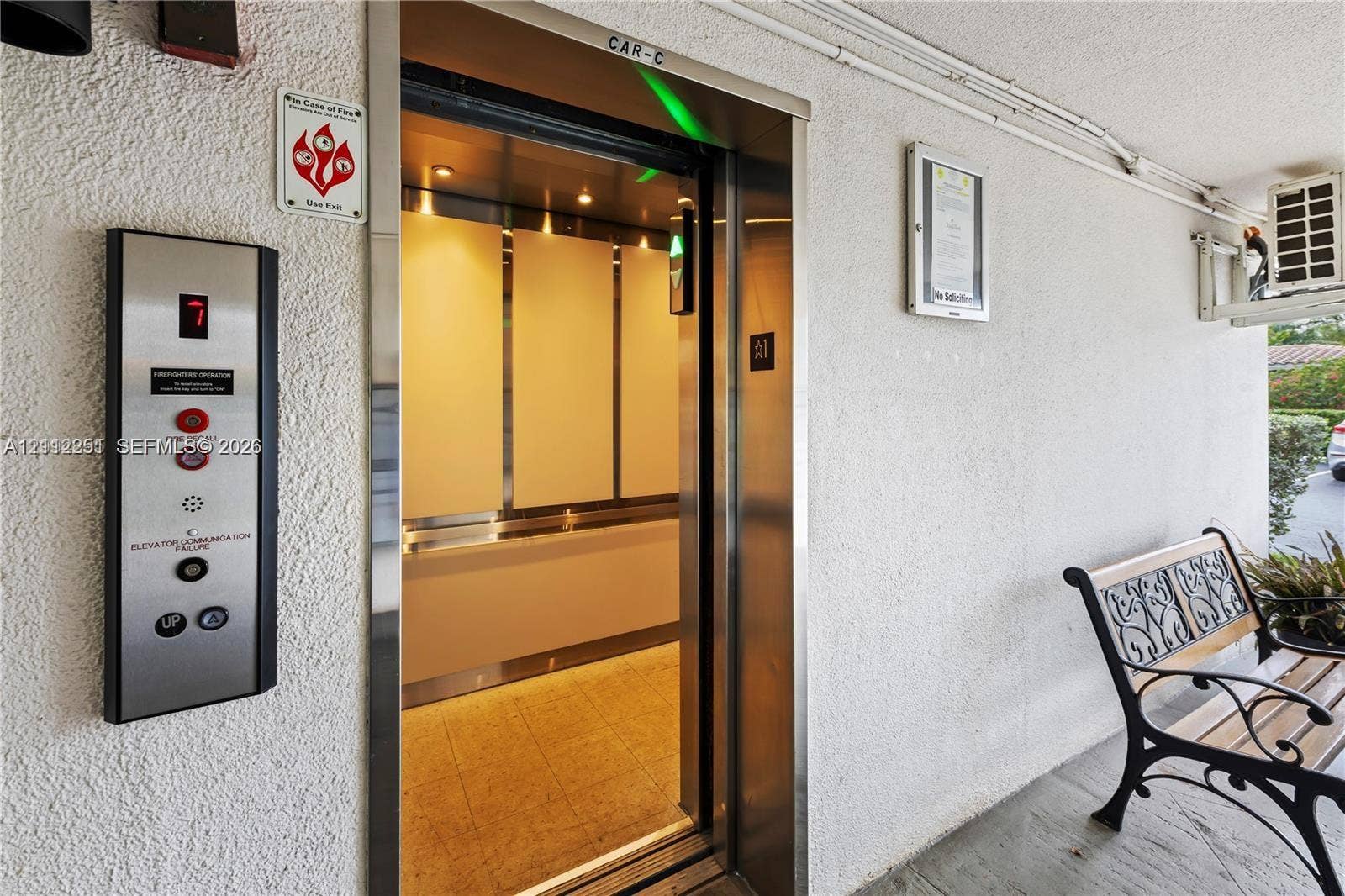 4025 N Federal Highway, #226C, Oakland Park, FL 33308 Elevator access featuring a brushed metal control panel and high-contrast interior paneling